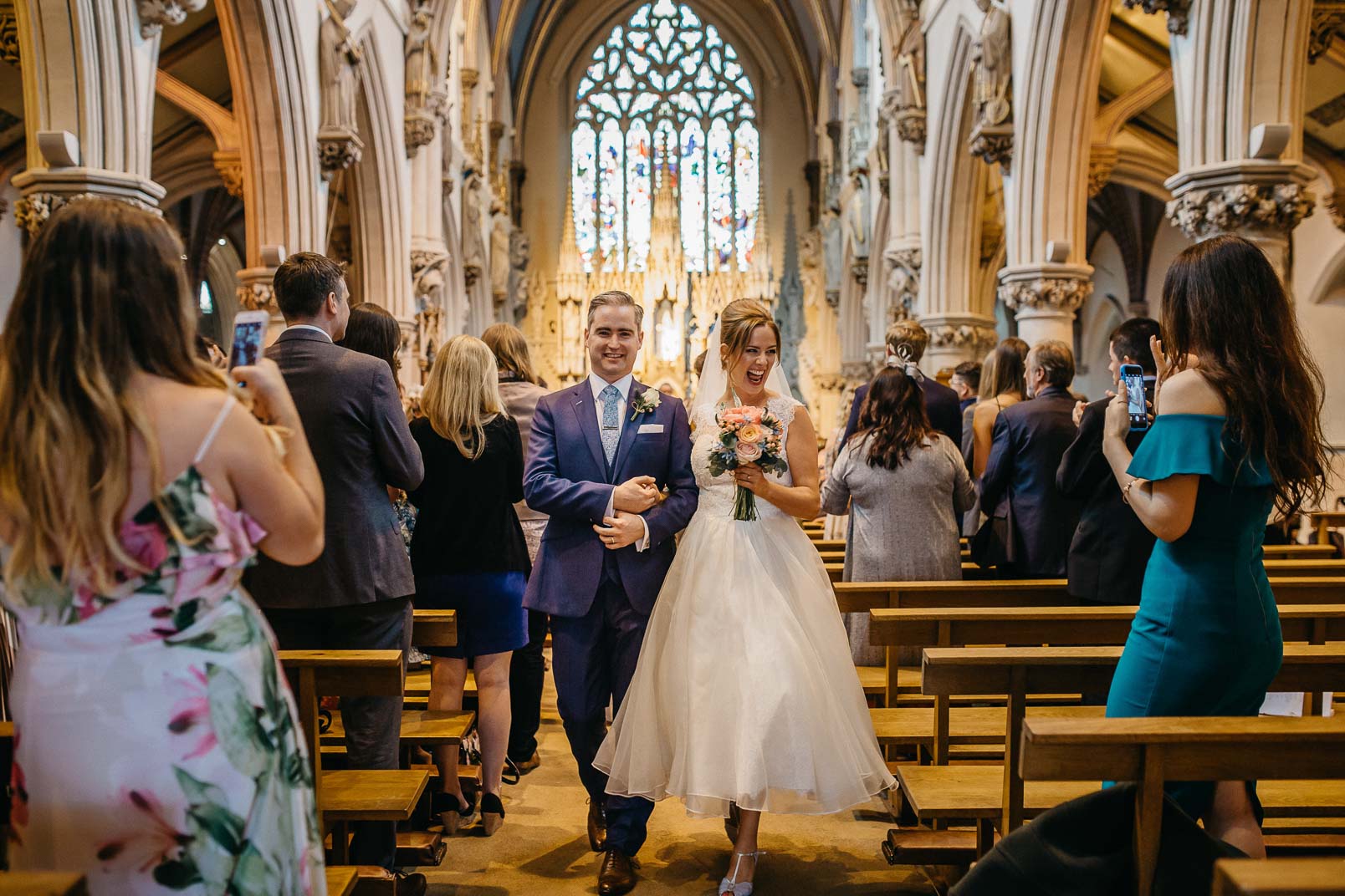 bride and groom walking from ceremony