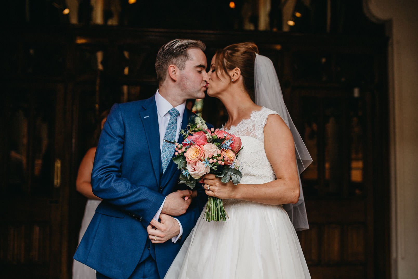 bride and groom kiss