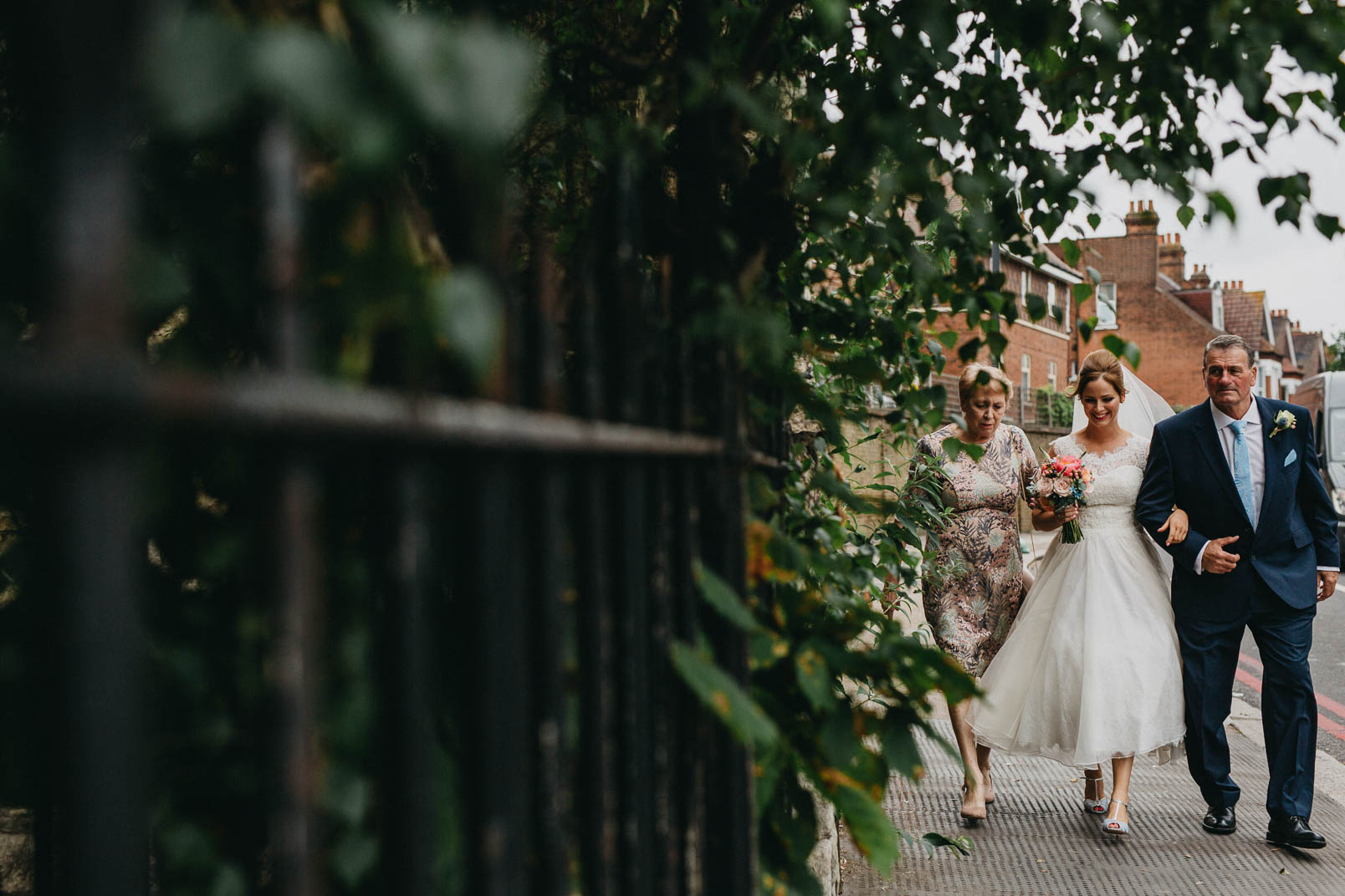 bride walking with parents